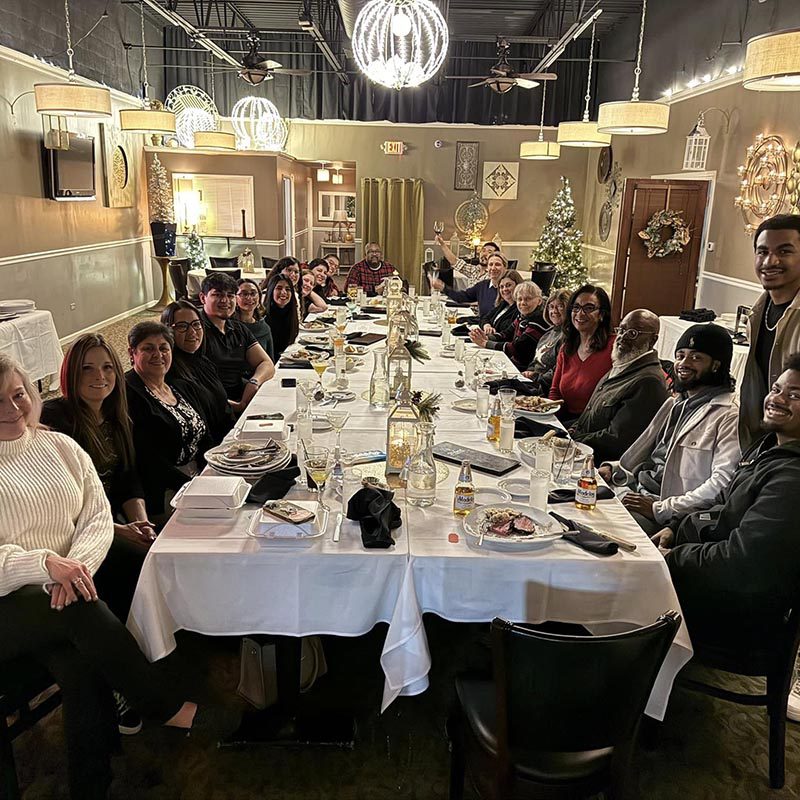 everyone gathered around for a fancy Christmas dinner