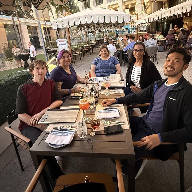 group poses for a photo at dinner
